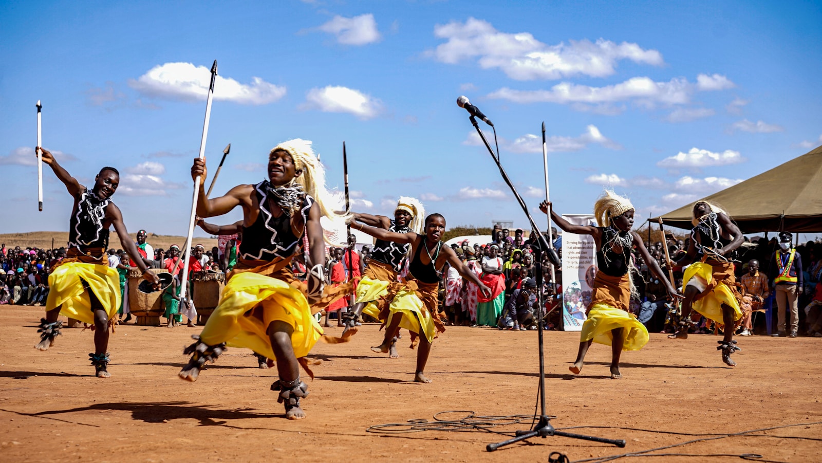 Dancers in traditional attire performing outdoors