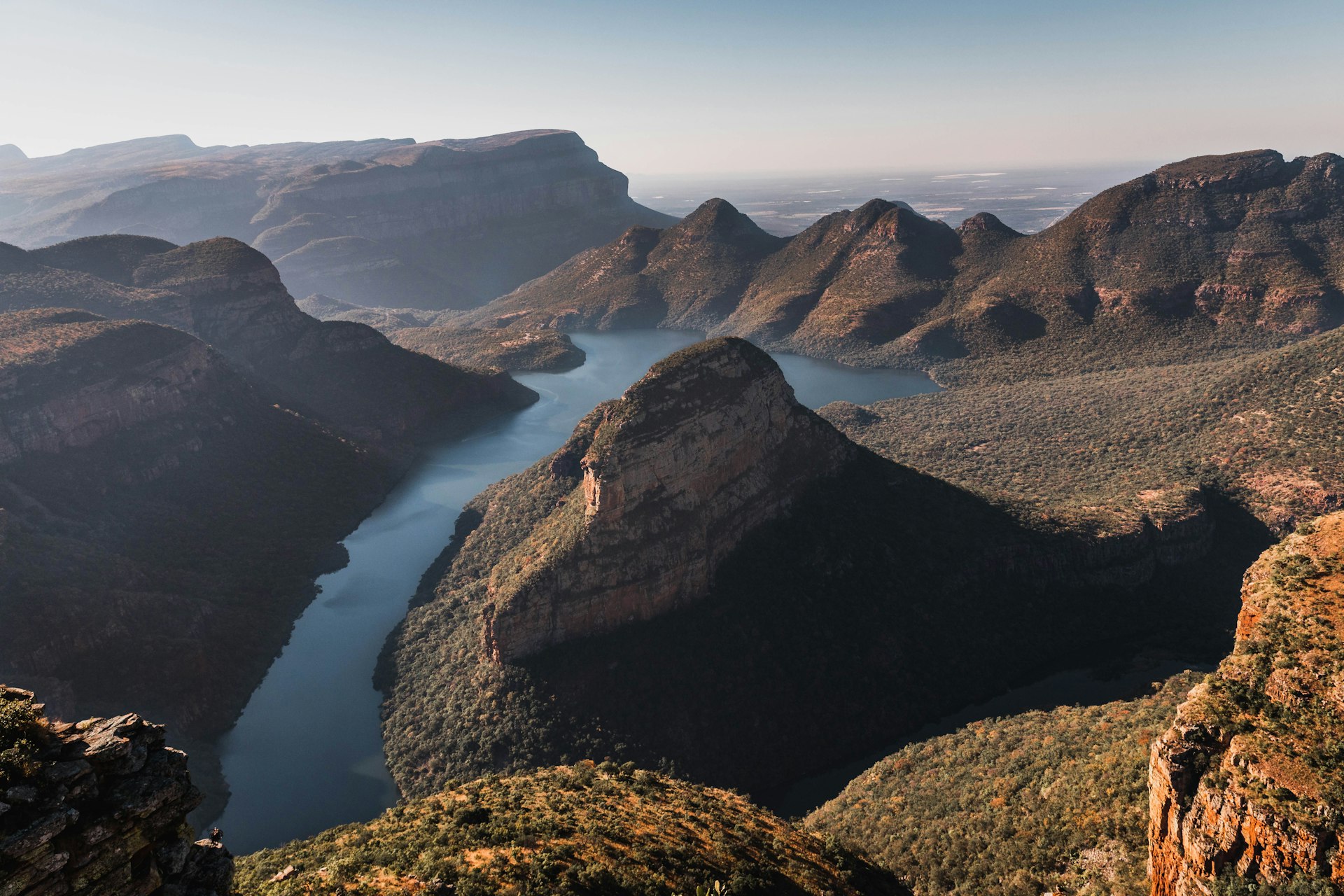A view of the Blyde River Canyon with a river running through the mountains