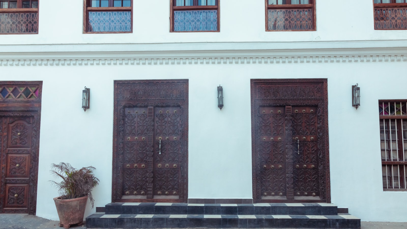 An ornately carved wooden door in Stone Town